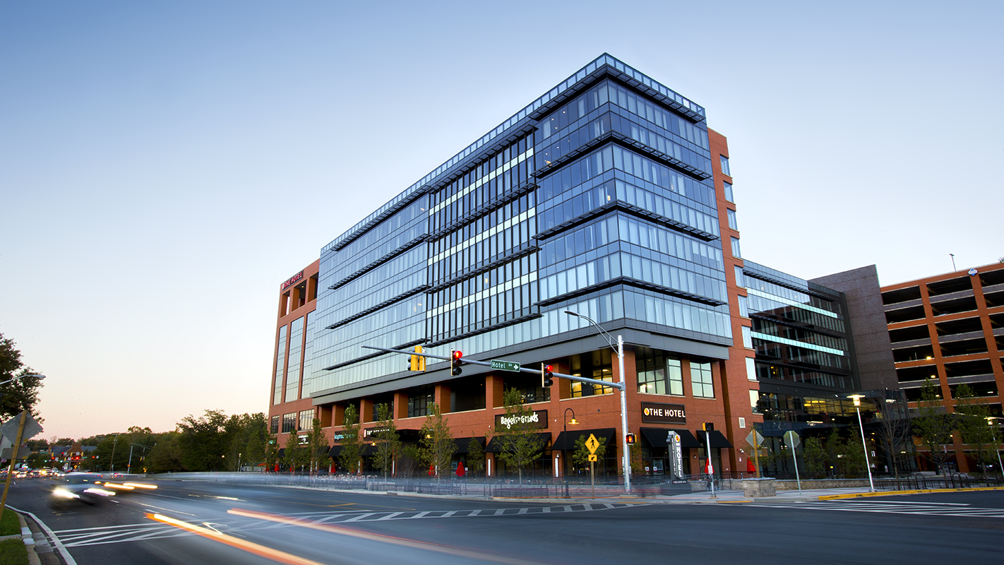 Street view of The Hotel UMD from the opposite side of Baltimore Avenue, at sunset.